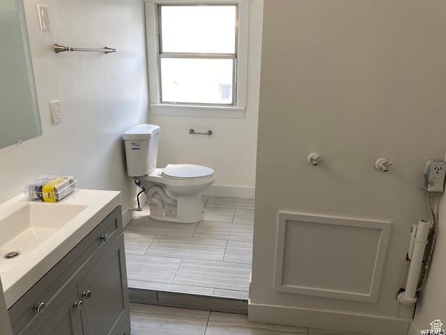 230 N 3rd St, Tooele, UT 84074 - bathroom with tile patterned floors, vanity, and toilet