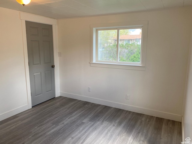 230 N 3rd St, Tooele, UT 84074 - spare room featuring dark wood-type flooring