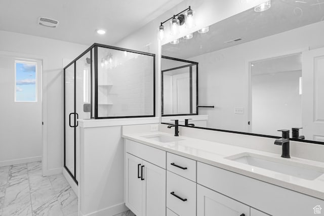 2869 S Ritter Row W Unit 54, West Valley City, UT 84128 - bathroom with marble finish floor, a shower stall, visible vents, and a sink