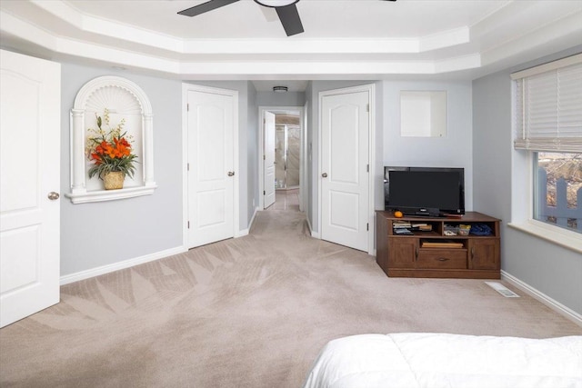 939 E Summit Dr N, Smithfield, UT 84335 - bedroom featuring light carpet, a tray ceiling, crown molding, and ceiling fan