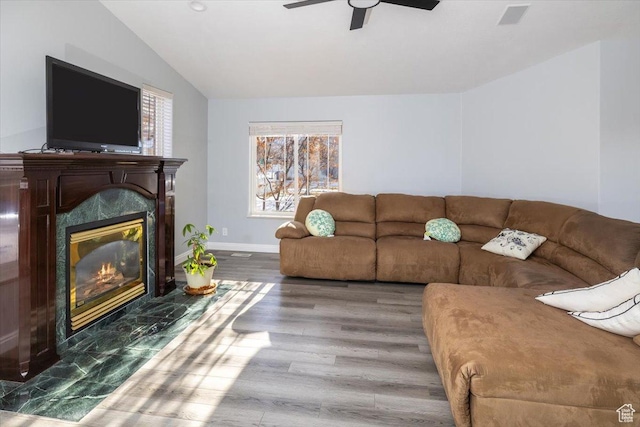 939 E Summit Dr N, Smithfield, UT 84335 - living room with lofted ceiling, a high end fireplace, wood-type flooring, and ceiling fan