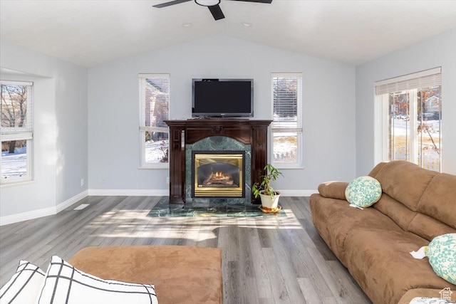 939 E Summit Dr N, Smithfield, UT 84335 - living room featuring hardwood / wood-style flooring, ceiling fan, a high end fireplace, and vaulted ceiling