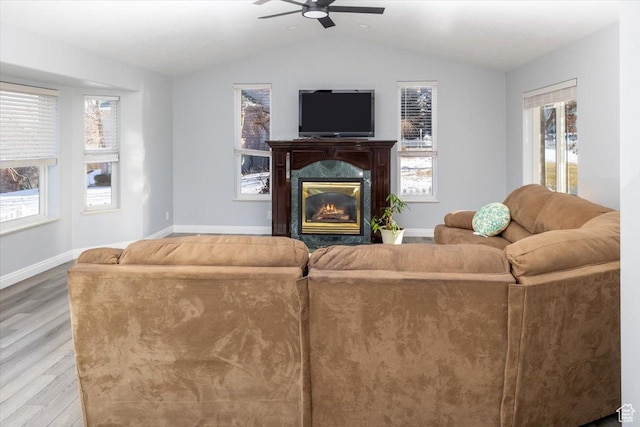 939 E Summit Dr N, Smithfield, UT 84335 - living room featuring wood-type flooring, lofted ceiling, ceiling fan, and a fireplace