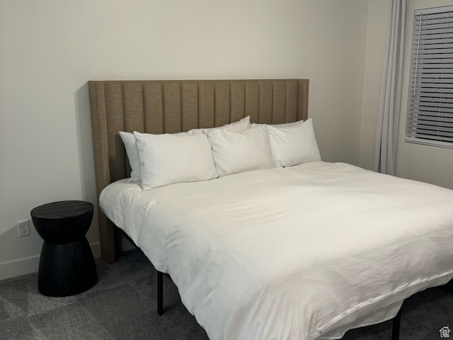 carpeted bedroom with baseboards
