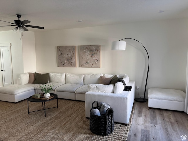 living room featuring wood finished floors and ceiling fan
