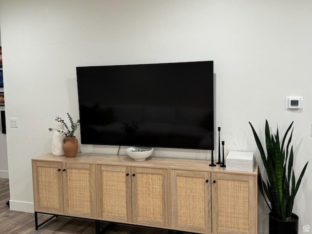 details with wood finished floors and baseboards