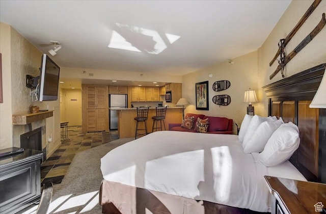 bedroom featuring refrigerator and freestanding refrigerator