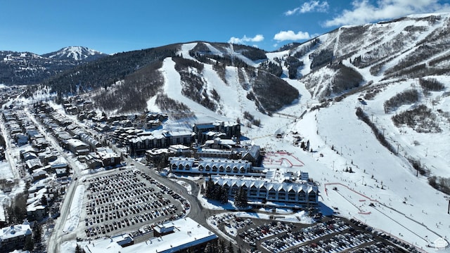 snowy aerial view featuring a mountain view