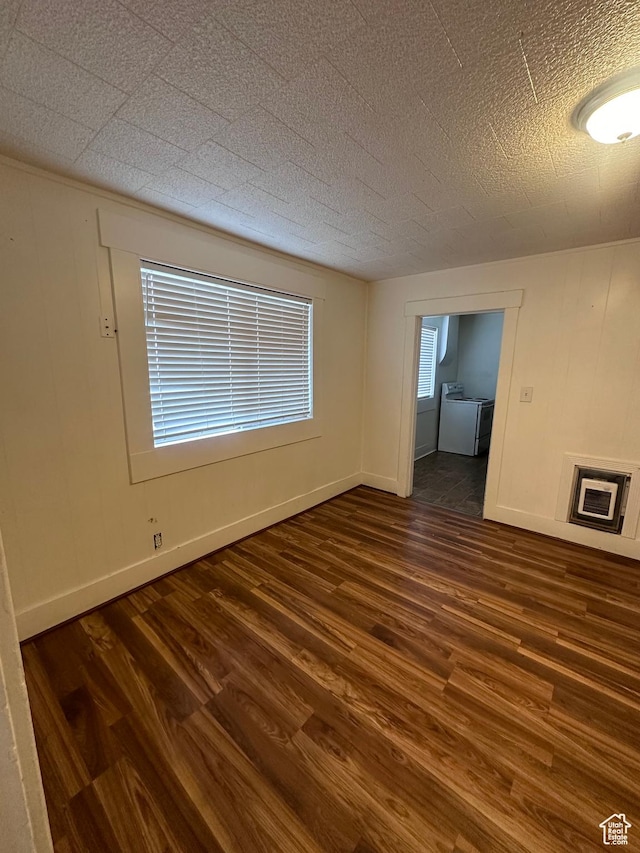 spare room with dark hardwood / wood-style flooring