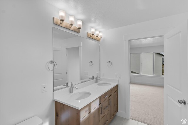 550 N 735 W, Smithfield, UT 84335 - bathroom featuring tile patterned flooring, vanity, and toilet