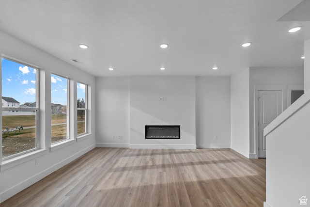 550 N 735 W, Smithfield, UT 84335 - unfurnished living room featuring light wood-type flooring