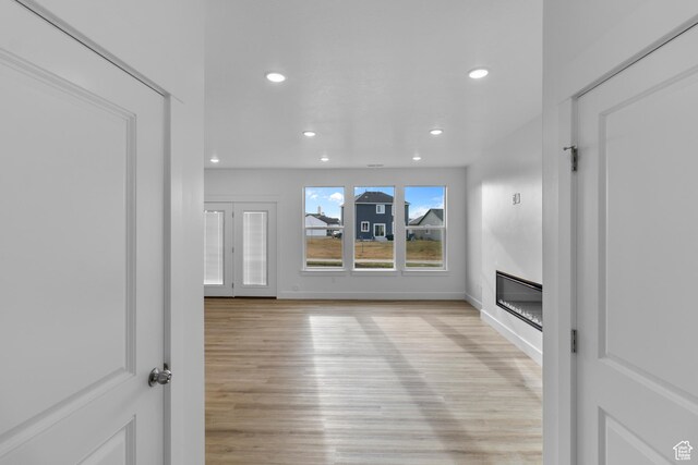 550 N 735 W, Smithfield, UT 84335 - unfurnished living room featuring light wood-type flooring
