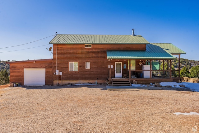view of front of house with a garage and a porch