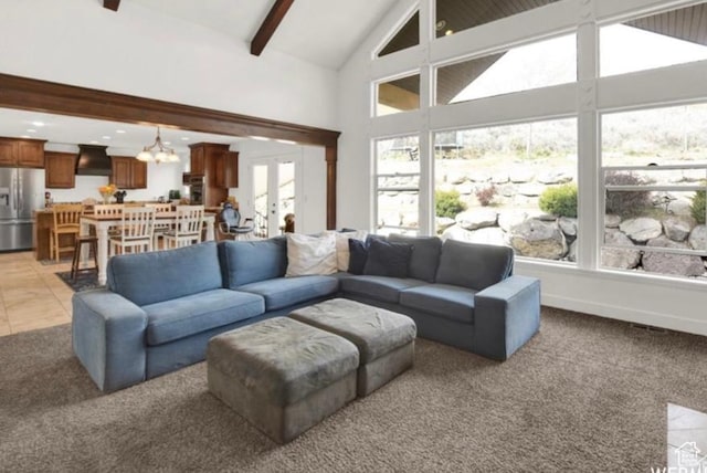 14548 S Rose Ave, Herriman, UT 84096 - carpeted living room with high vaulted ceiling, an inviting chandelier, beam ceiling, and french doors