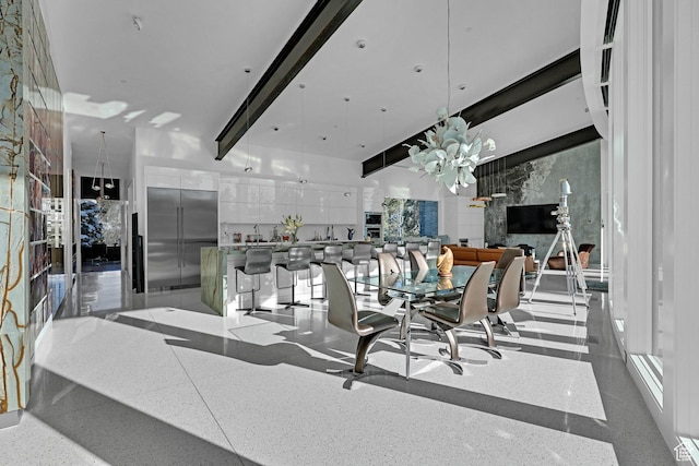 dining room featuring beamed ceiling