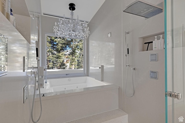 bathroom with an inviting chandelier and plus walk in shower
