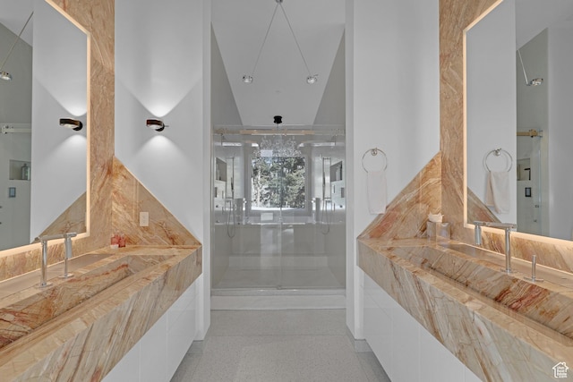 bathroom with a shower with door