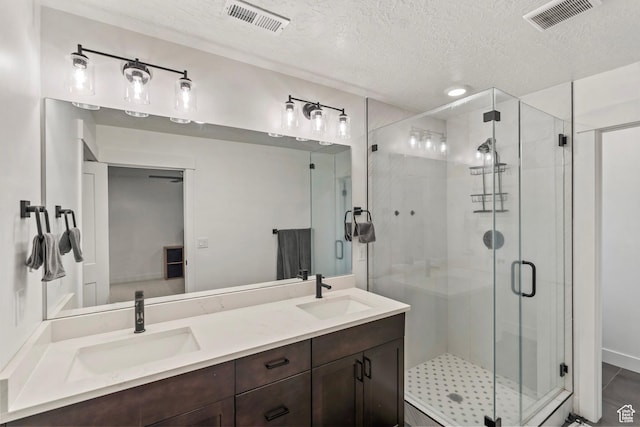 6850 Mountain Maple Dr Unit 14, Park City, UT 84098 - bathroom featuring walk in shower, vanity, and a textured ceiling