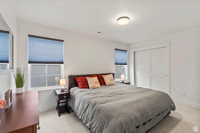 6850 Mountain Maple Dr Unit 14, Park City, UT 84098 - bedroom featuring a closet, light carpet, and a textured ceiling