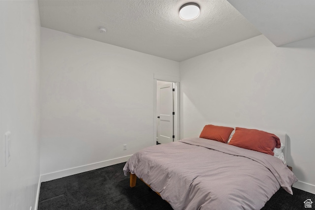 6850 Mountain Maple Dr Unit 14, Park City, UT 84098 - bedroom featuring a textured ceiling and dark colored carpet