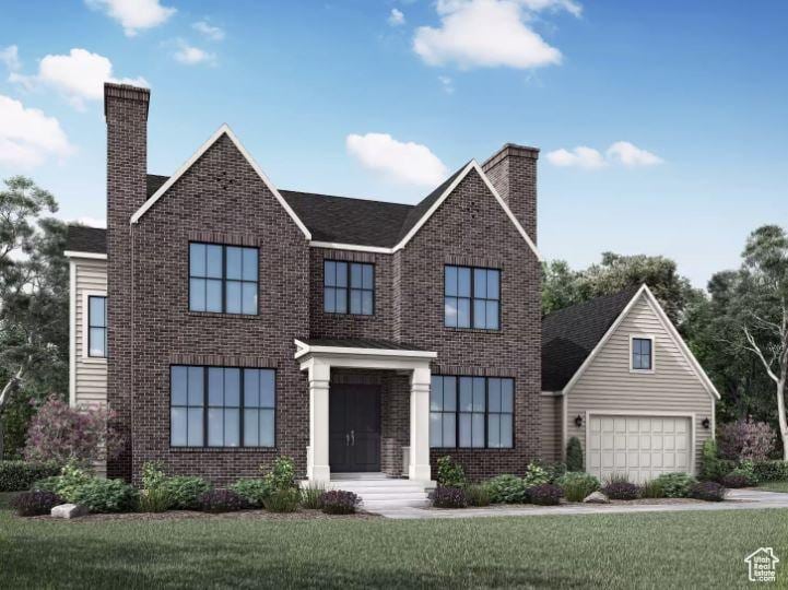 view of front of house with a garage and a front lawn