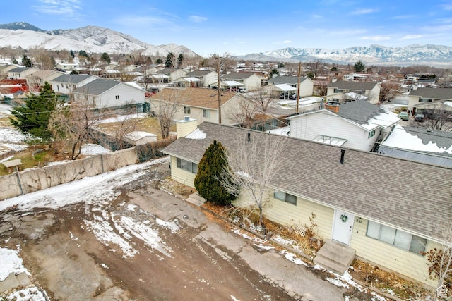 snowy aerial view featuring a mountain view