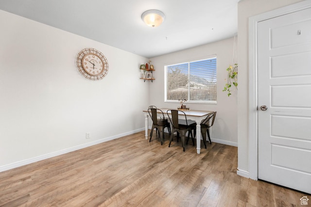 dining area with light wood-type flooring