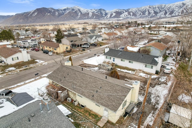 snowy aerial view with a mountain view