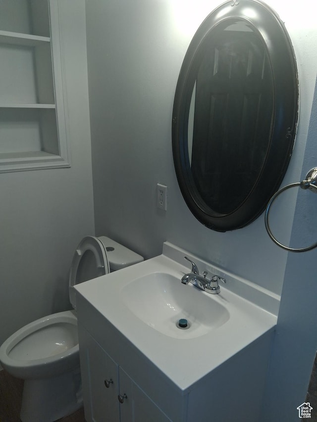 541 41st St, South Ogden, UT 84403 - bathroom featuring vanity and toilet