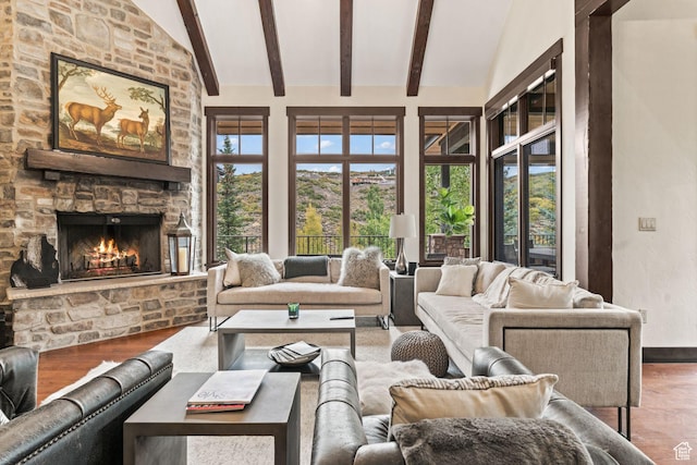 8670 Ranch Club Ct, Park City, UT 84098 - living room featuring wood-type flooring, a stone fireplace, and vaulted ceiling with beams