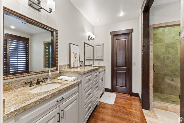 8670 Ranch Club Ct, Park City, UT 84098 - bathroom featuring vanity, hardwood / wood-style floors, and a shower with shower door