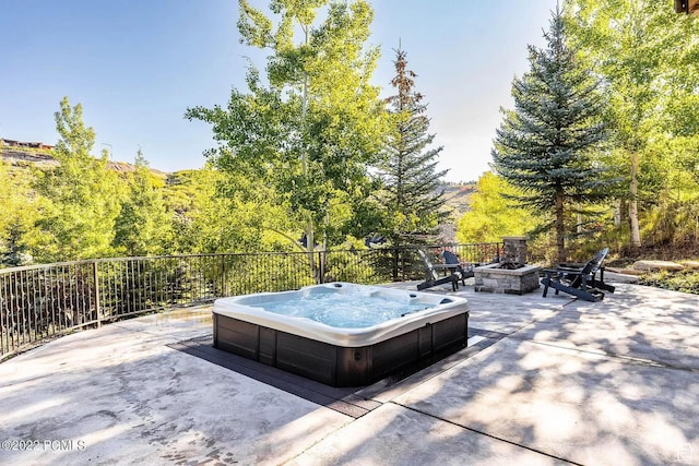 8670 Ranch Club Ct, Park City, UT 84098 - view of patio / terrace featuring an outdoor hot tub and a fire pit