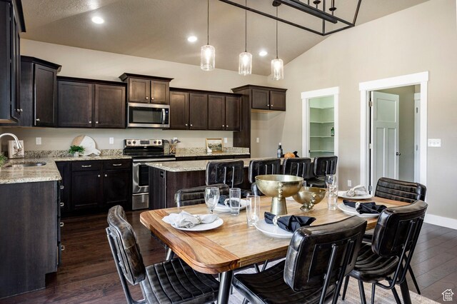 7104 S Cadens Cv, Cottonwood Heights, UT 84121 - dining room with dark wood finished floors, vaulted ceiling, recessed lighting, and baseboards