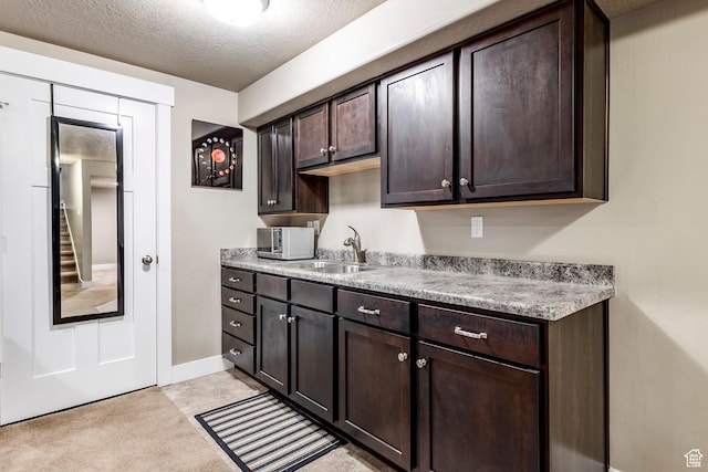 7104 S Cadens Cv, Cottonwood Heights, UT 84121 - kitchen with sink, dark brown cabinets, and a textured ceiling