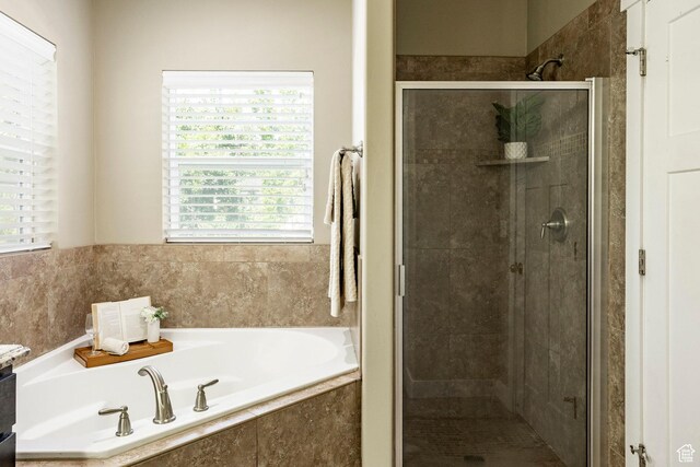 7104 S Cadens Cv, Cottonwood Heights, UT 84121 - bathroom with plenty of natural light, a garden tub, and a stall shower