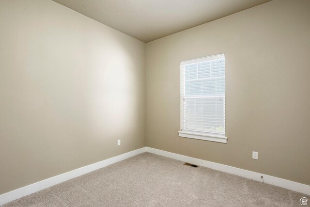 7104 S Cadens Cv, Cottonwood Heights, UT 84121 - empty room with light carpet, baseboards, and healthy amount of natural light
