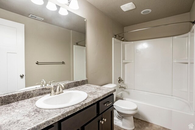 7104 S Cadens Cv, Cottonwood Heights, UT 84121 - bathroom with vanity, tub / shower combination, toilet, and a textured ceiling