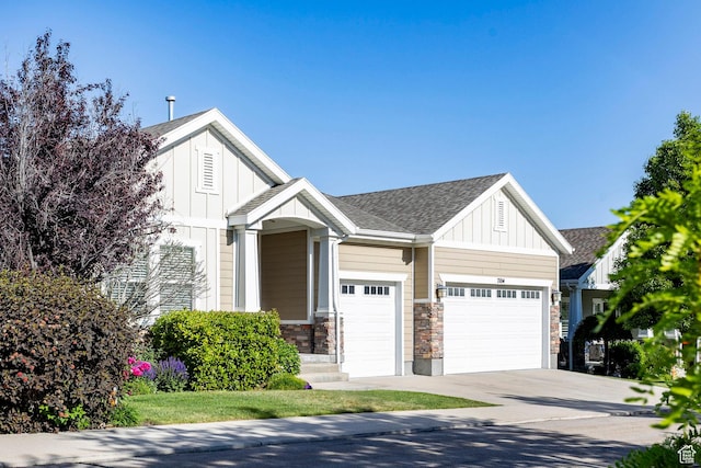 7104 S Cadens Cv, Cottonwood Heights, UT 84121 - view of front facade featuring board and batten siding, an attached garage, concrete driveway, stone siding, and roof with shingles