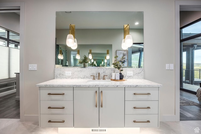 1817 W Skyridge Dr, Heber City, UT 84032 - ensuite bathroom with plenty of natural light, backsplash, and vanity