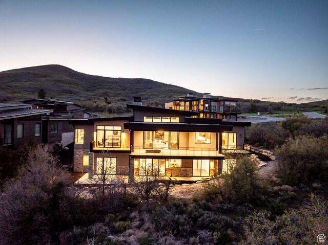 1817 W Skyridge Dr, Heber City, UT 84032 - rear view of house with a balcony, a mountain view, and stucco siding