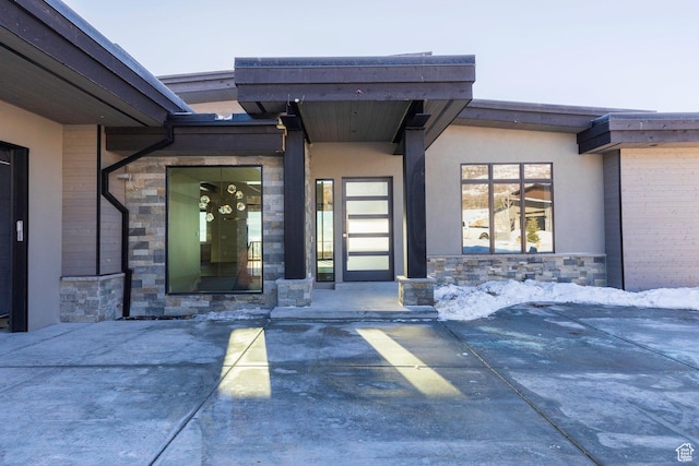 doorway to property with a patio