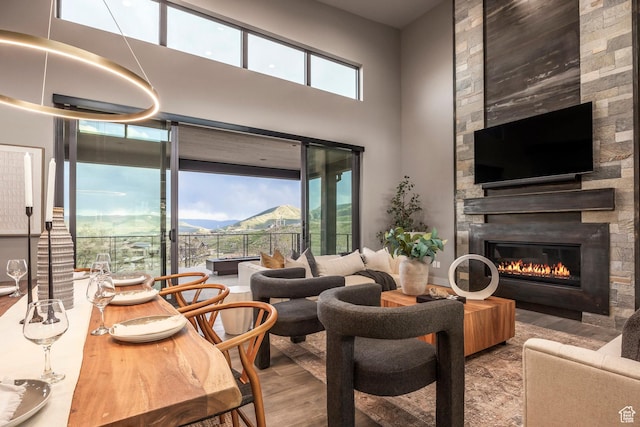 1817 W Skyridge Dr, Heber City, UT 84032 - living area featuring wood finished floors, a fireplace, and a towering ceiling