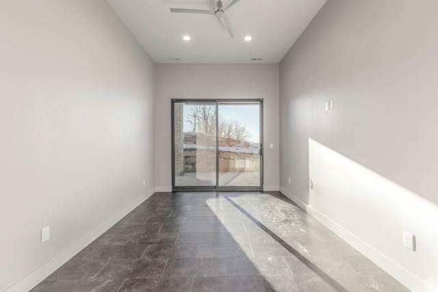 unfurnished room with ceiling fan