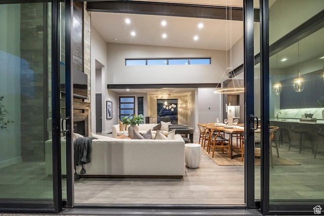 1817 W Skyridge Dr, Heber City, UT 84032 - living room with high vaulted ceiling, a fireplace, wood finished floors, recessed lighting, and baseboards