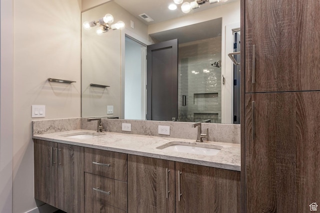 bathroom with vanity and an enclosed shower
