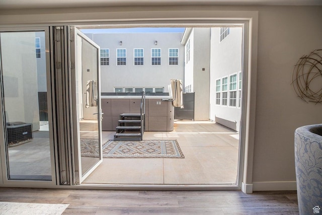 doorway with light hardwood / wood-style floors