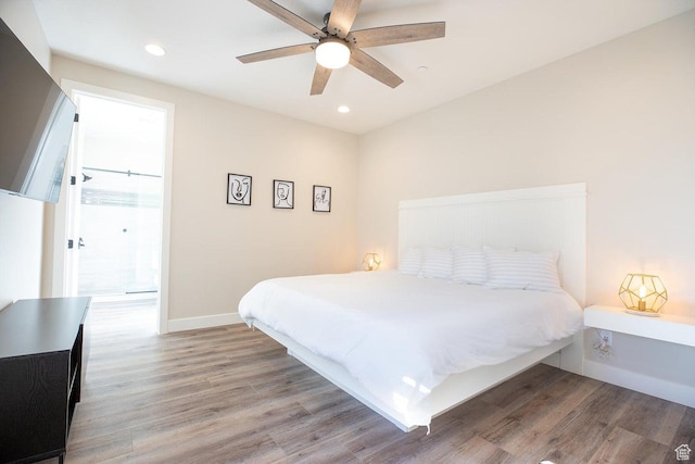 bedroom featuring hardwood / wood-style flooring and ceiling fan