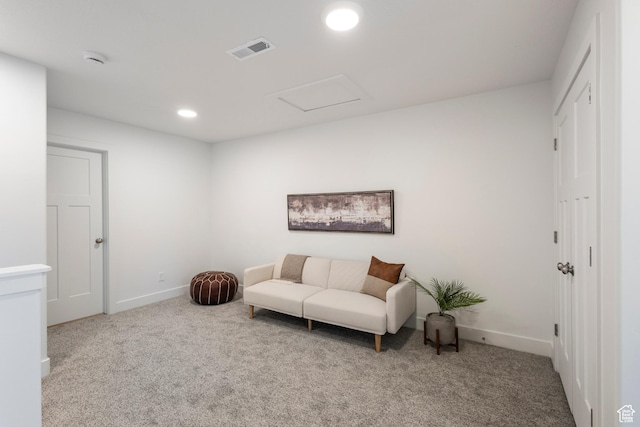 living area featuring light colored carpet