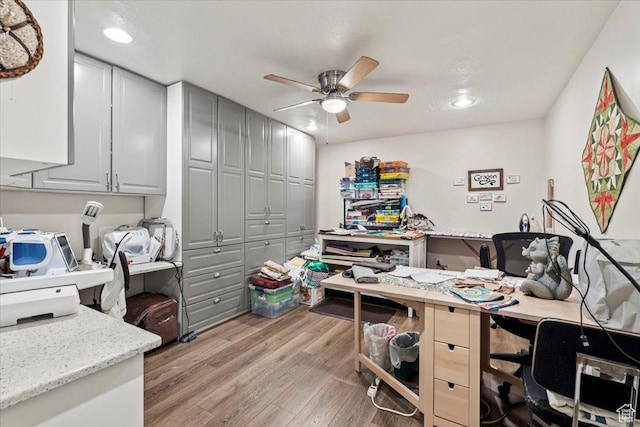 office space featuring recessed lighting, light wood-style floors, and ceiling fan