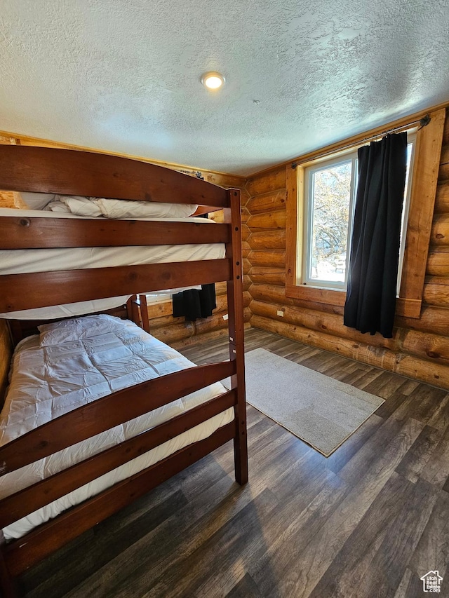 11905 E 24560 N, Fairview, UT 84629 - unfurnished bedroom featuring dark hardwood / wood-style flooring and log walls